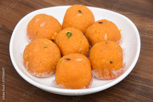 Indian sweet food or diwali sweets Mithai Halwa, Milk Peda, Laddu or Ladoo, Rasgulla, Rasagulla for celebration in Delhi, India. photo