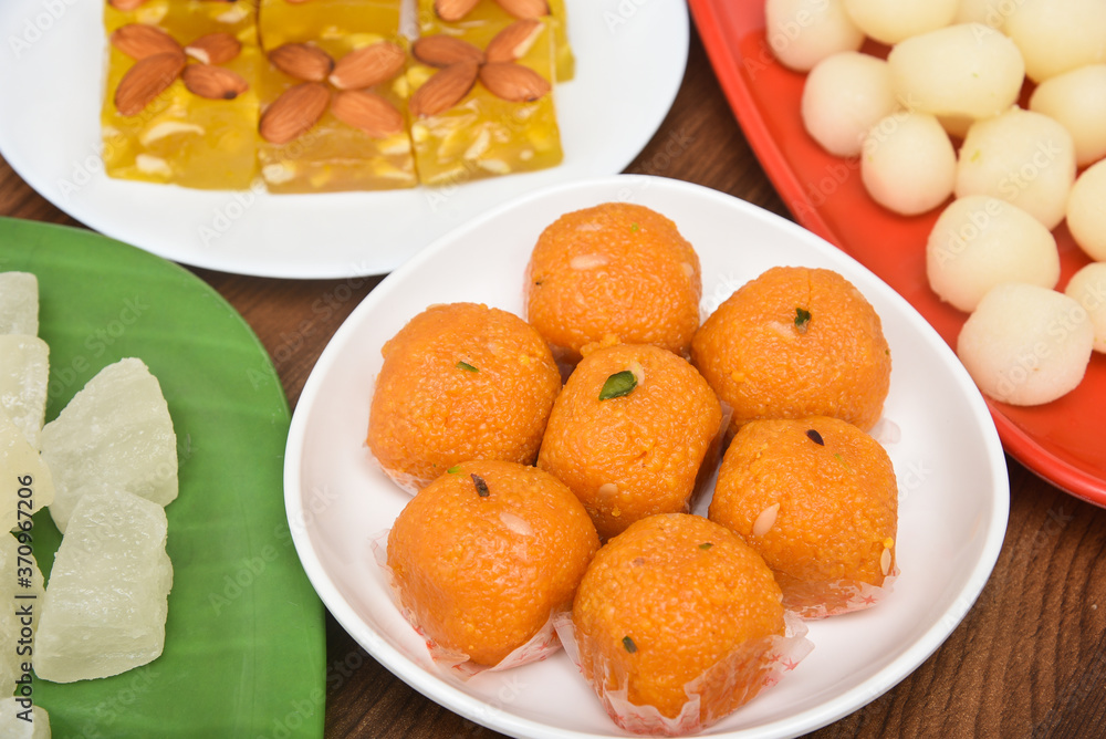 Burfi Delhi sweets for Diwali Indian mithai. Indian sweet food or diwali sweets Mithai Halwa, Milk Peda, Laddu or Ladoo, Rasgulla, Rasagulla for celebration in Delhi, India. Burfi Delhi sweets for Diwali Indian mithai. Indian sweet food or diwali sweets Mithai Halwa, Milk Peda, Laddu or Ladoo, Rasgulla, Rasagulla for celebration in Delhi, India.