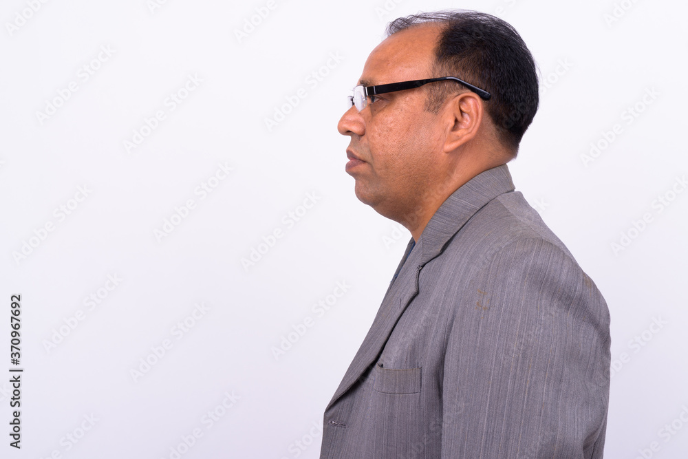 Portrait of mature overweight Indian businessman in suit Portrait of mature overweight Indian businessman in suit