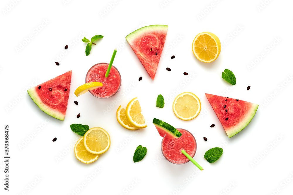 Naklejka premium Watermelon, lemon colorful isolated on white background. Fresh red yellow watermelon slices, citrus creative composition, top view. Lemonade in glass, fashionable trendy summer beverage, flat lay