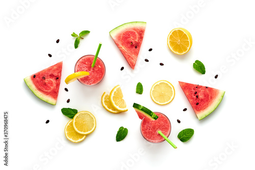 Fototapeta Naklejka Na Ścianę i Meble -  Watermelon, lemon colorful isolated on white background. Fresh red yellow watermelon slices, citrus creative composition, top view. Lemonade in glass, fashionable trendy summer beverage, flat lay