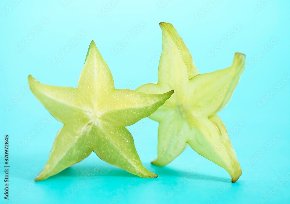 Fototapeta premium Carambola Star Fruit, averrhoa carambola, Fruit against Blue Background
