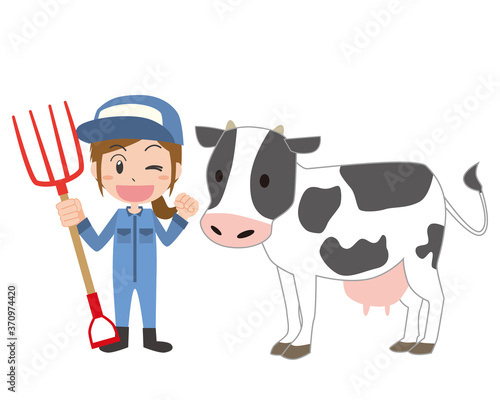 酪農家の女性と乳牛