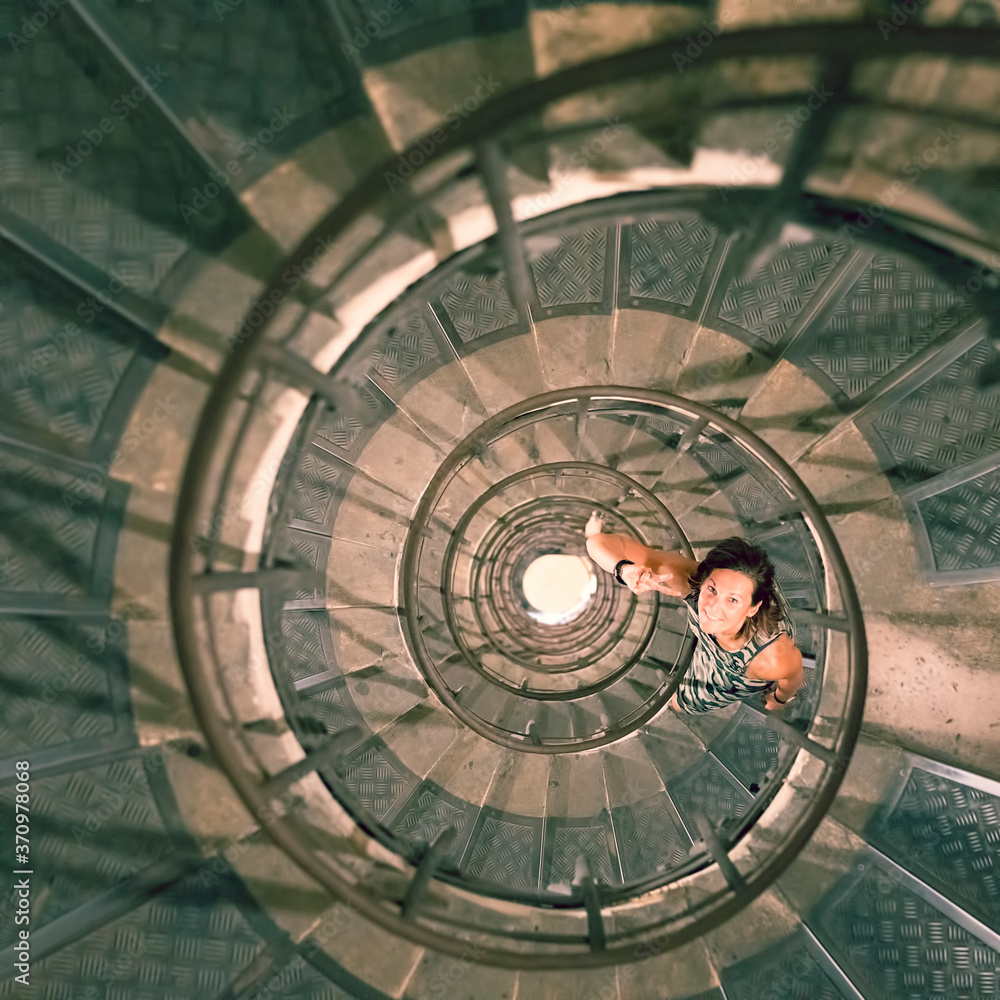 Woman in spiral staircase