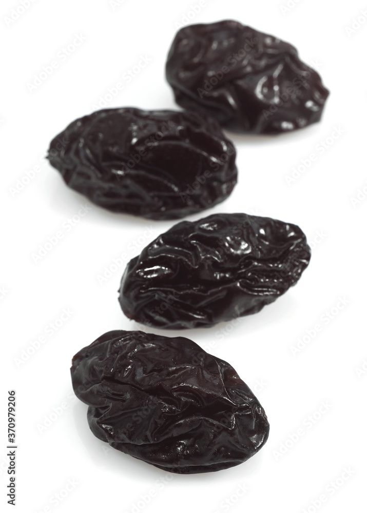 Dry Prunes against White Background Dry Prunes against White Background