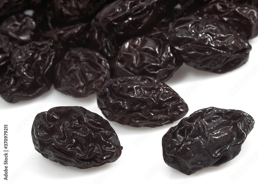 Dry Prunes against White Background Dry Prunes against White Background