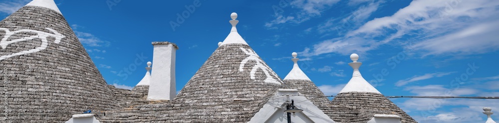 panorama of a souther of the Italy, albero bello with blue sky and the trulli in background