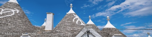 panorama of a souther of the Italy, albero bello with blue sky and the trulli in background photo