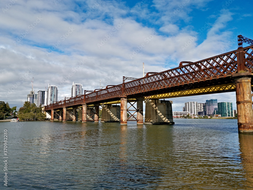 Beautiful view of a railway bridge across a river on a sunny day with deep blue sky and light clouds, Parramatta river, Meadowbank, Sydney, New South Wales, Australia
Beautiful view of a railway bridge across a river on a sunny day with deep blue sky and light clouds, Parramatta river, Meadowbank, Sydney, New South Wales, Australia