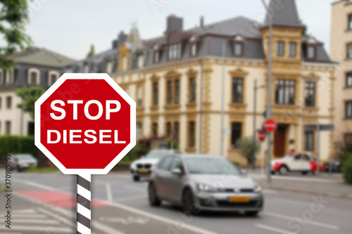 Stop sign for diesel cars in city, introducing ban on production and trade of diesel cars, development of alternative energy, ecology, environmental protection © kittyfly