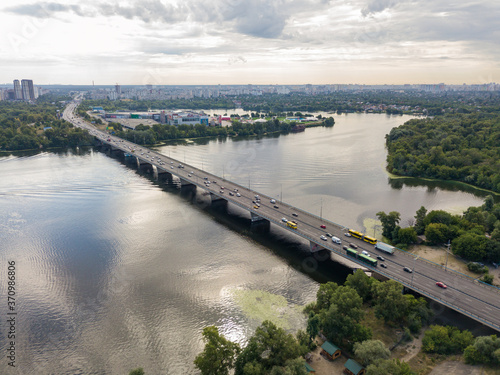 Aerial drone view. Cars travel along the North Bridge across the Dnieper in Kiev. © Sergey