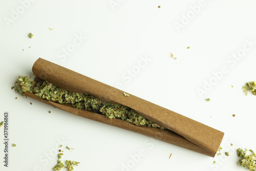 Cannabis blunt roll on white background isolated photo