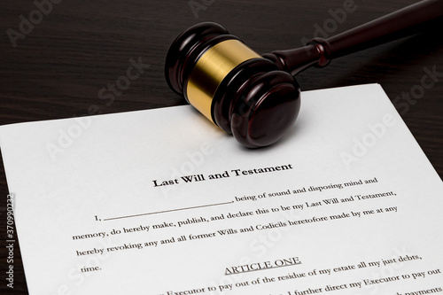 Last will and testament with gavel. Concept of planning for death, final wishes, probate court system, guardianship, inheritance tax and terminal illness