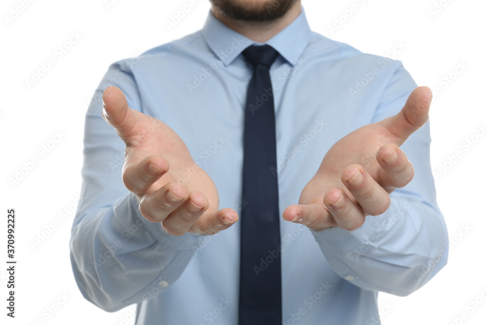 Businessman holding something against white background, focus on hands Businessman holding something against white background, focus on hands