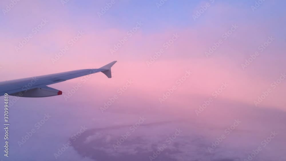 Pink sky clouds from plane Pink sky clouds from plane