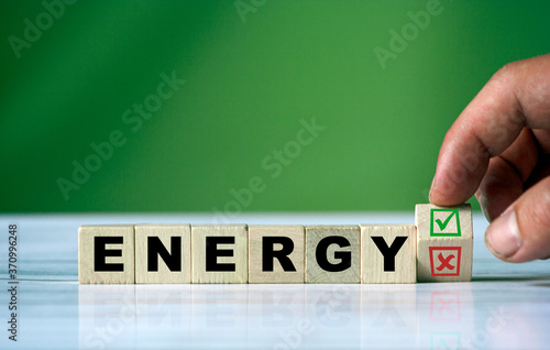 and turns the wooden cube and changes the word ENERGY