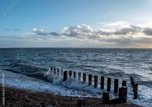 waves crashing against the groynes © Penny