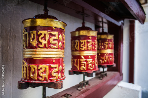 Three beautiful prayer wheels in the Himalayas, Nepal