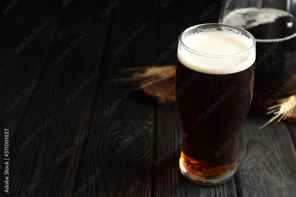 Glass of delicious kvass on wooden table. Space for text Glass of delicious kvass on wooden table. Space for text