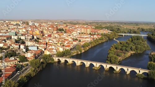 Zamora stone bridge over river. Zamora, historical city of Spain. Aerial Drone Footage  photo