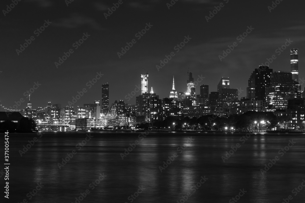 Black and White Nighttime Roosevelt Island and Manhattan Skyline along the East River in New York City