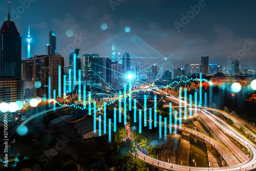 Photography FOREX graph hologram, aerial night panoramic cityscape of Kuala Lumpur