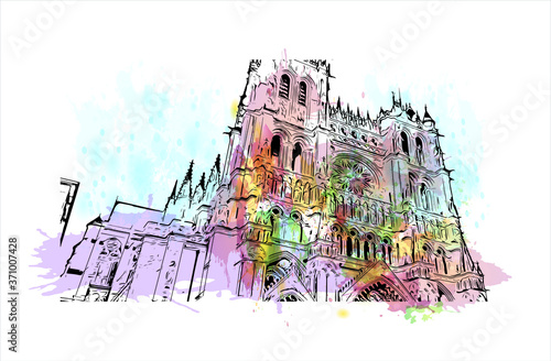Building view with landmark of Amiens is a city in northern France, divided by the Somme river. Watercolor splash with hand drawn sketch illustration in vector.