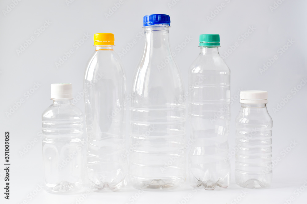 Five clear plastic bottles on a white background. Ecology. Five clear plastic bottles on a white background. Ecology.