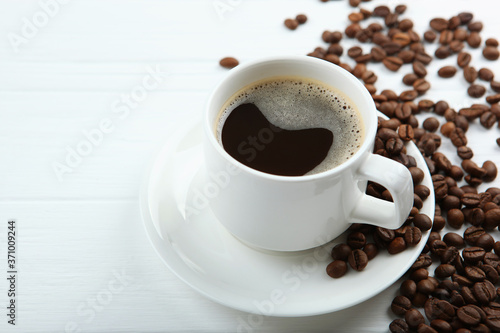 coffee beans and coffee cup on colored background with place for text 