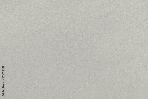 Gray homogeneous background with a textured surface, fabric. © Arkd