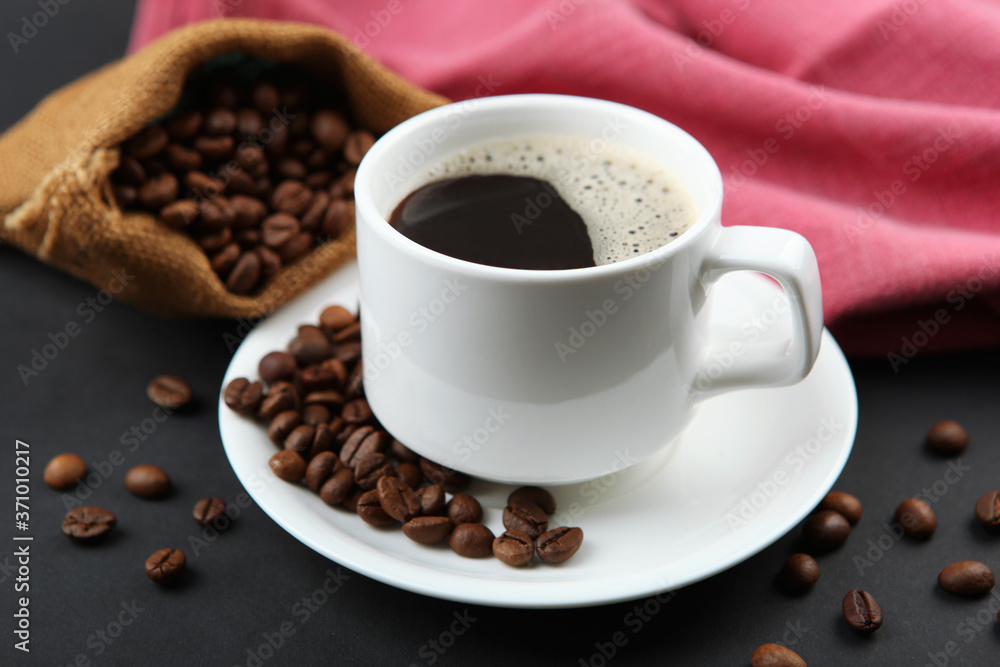 Fototapeta premium coffee beans and coffee cup on colored background with place for text 