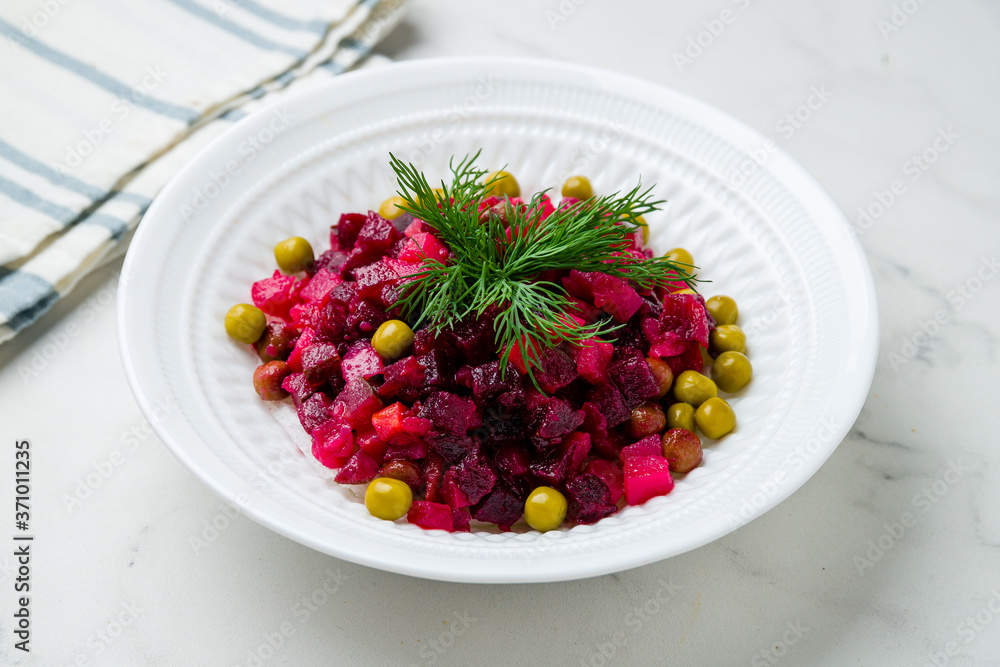 Vinaigrette on a white plate on marble table Vinaigrette on a white plate on marble table