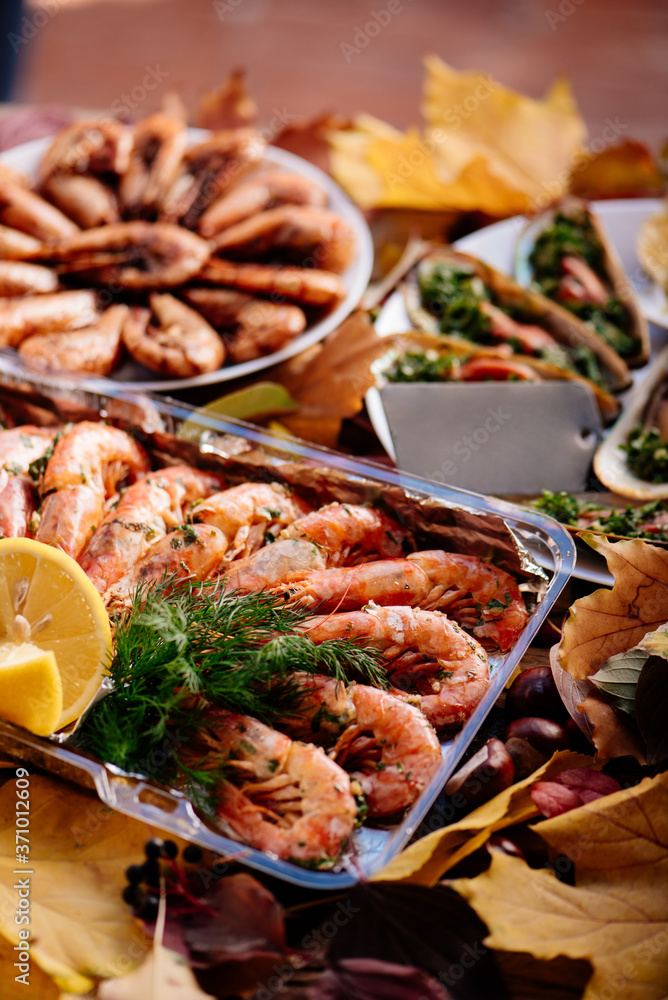 Shrimps and mussels on wooden table Shrimps and mussels on wooden table