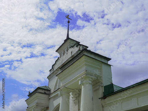 photo of the entrance gate tower above a cloudy sky