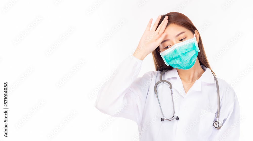 Tired young asian doctor. Portrait exhausted health care professional with headache, stressed, touching head overworked. isolated on white background, copy space. hanging stethoscope, wear face mask Tired young asian doctor. Portrait exhausted health care professional with headache, stressed, touching head overworked. isolated on white background, copy space. hanging stethoscope, wear face mask