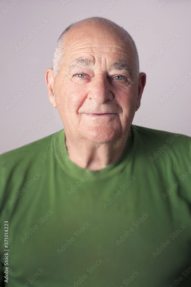 Senior man smiling in studio portrait Senior man smiling in studio portrait