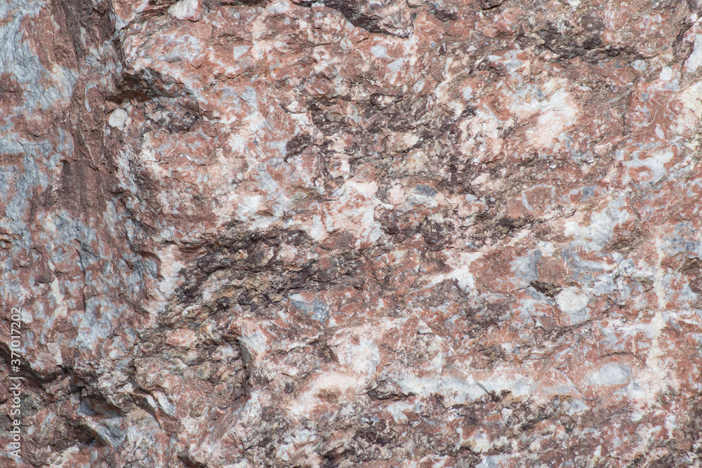 Naklejka premium The multicolored surface of the stone