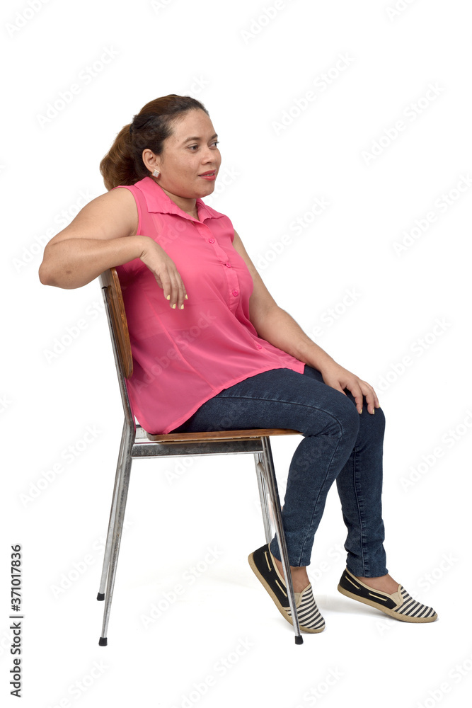 portrait of a woman sitting on a chair with the body in profile and look  side on white background, Stock Photo | Adobe Stock