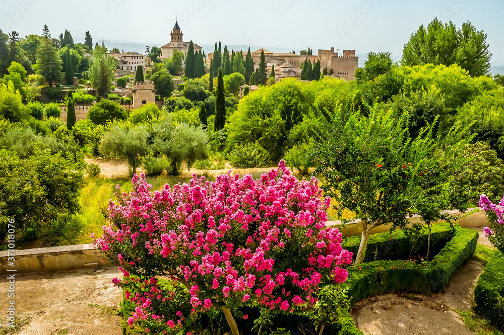 Blooms, gardens and view across the Alhambra district, Granada in the summertime