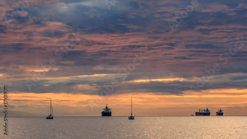 sunset on the beach on a cloudy day 