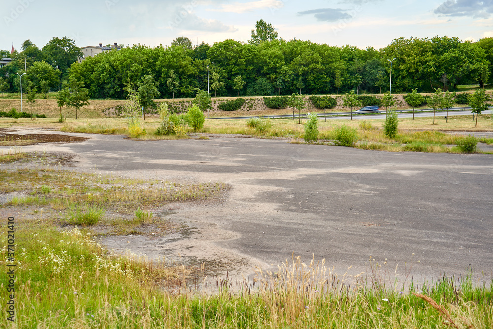 Huge abandoned parking lot near the highway 