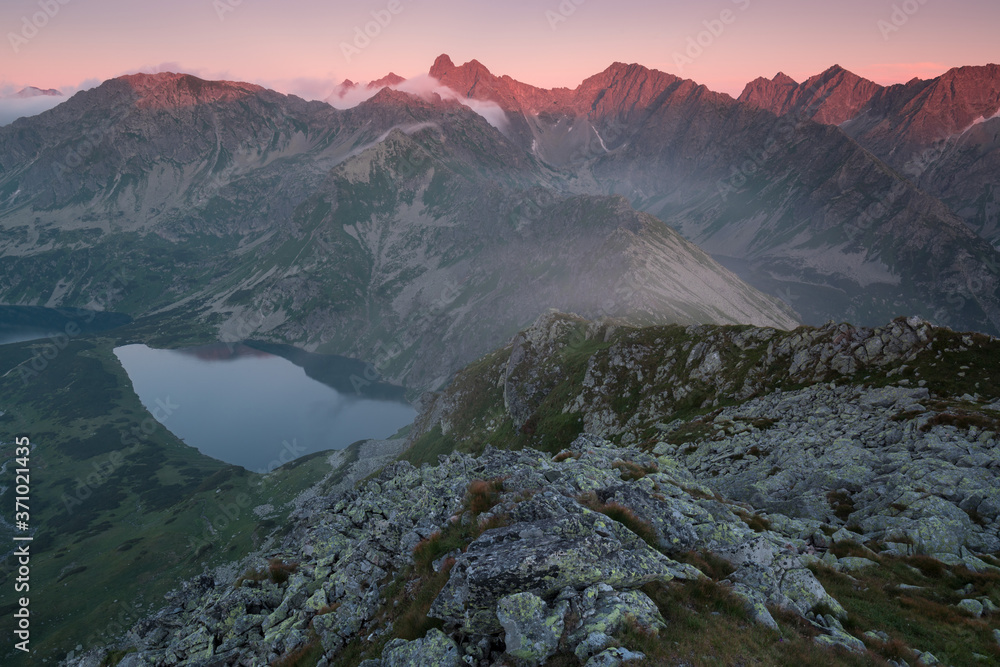 Sunset in High Tatras mountains national park in Slovakia. Scenic image of mountains. The sunrise over Carpathian mountains. Wonderful landscape. Picturesque view of nature. Amazing natural Background