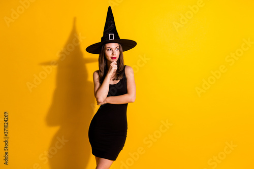 Portrait of her she nice-looking attractive pretty lovely bewildered minded lady wizard overthinking copy space planning strategy isolated on bright vivid shine vibrant yellow color background