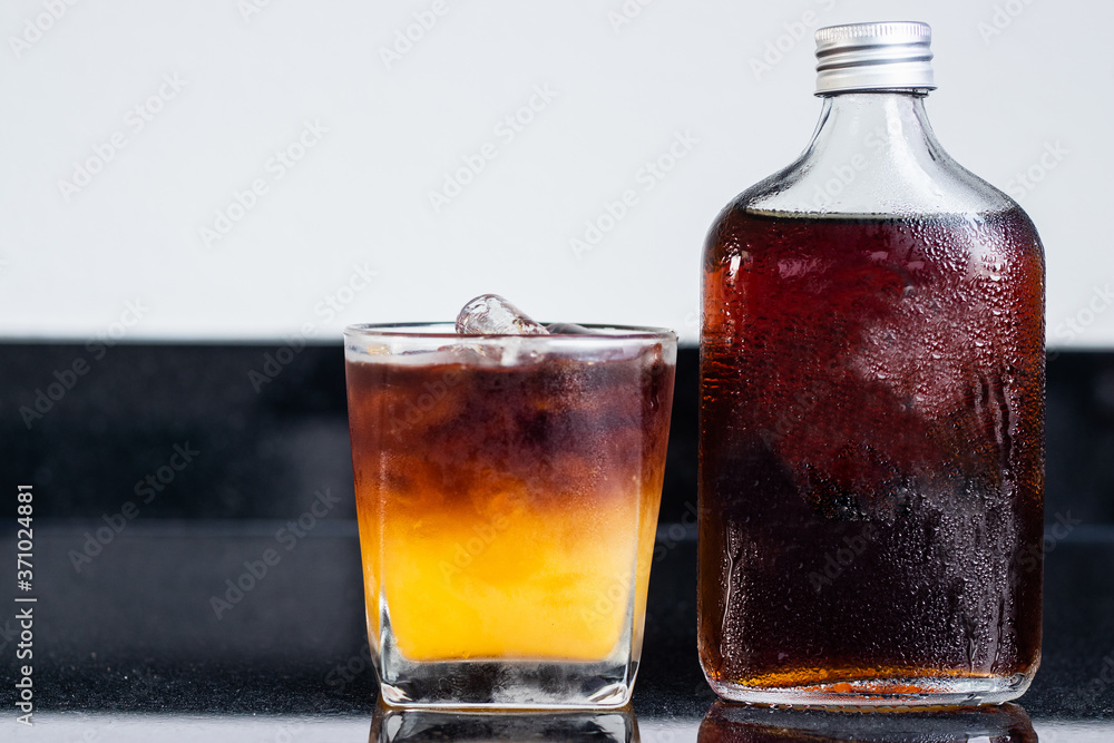 Black orange coffee with bottile of coldbrew coffee . Black orange coffee with bottile of coldbrew coffee .