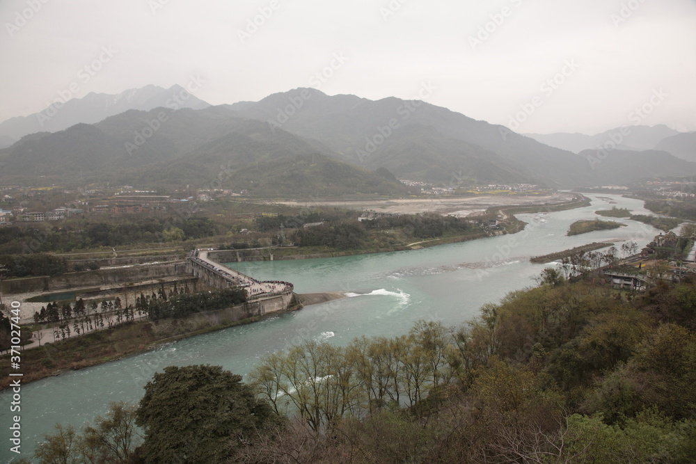 View of Chinese ancient irrigation system Dujiangyan with Fish Mouth Levee (Chinese: Yuzui) in Dujiangyan, Sichuan, China. 