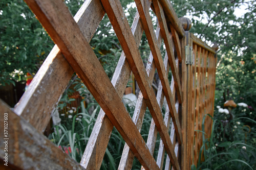 wooden fence in the garden at their summer cottage