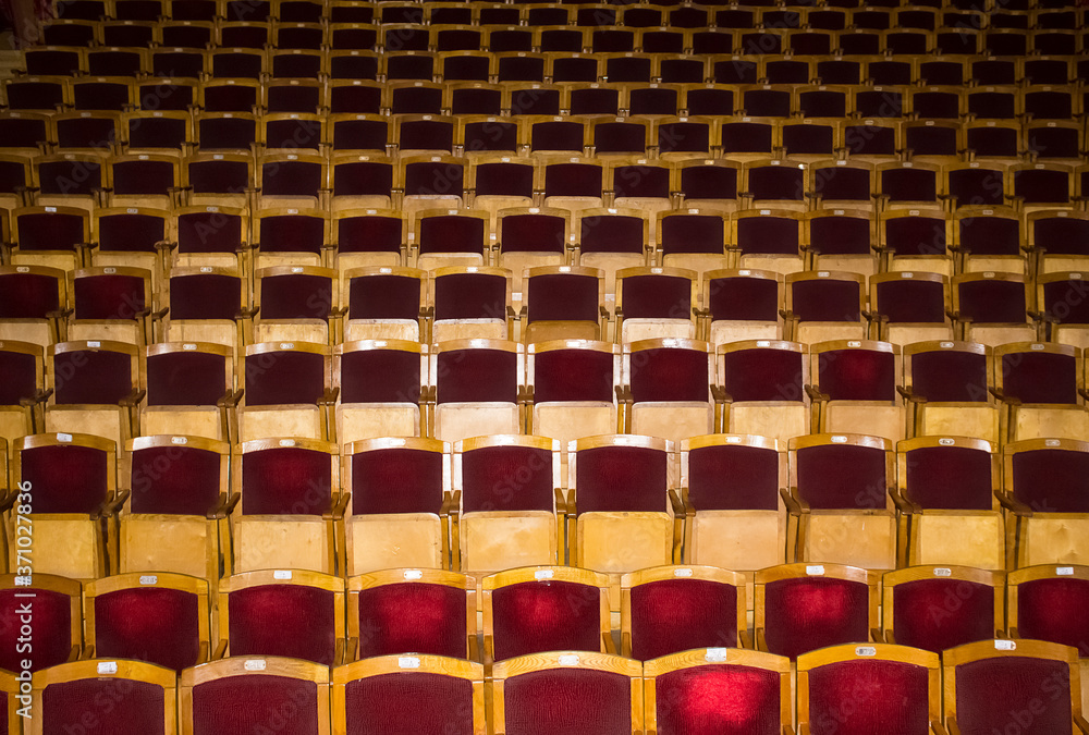 Fototapeta premium The empty theater with red seats. Conceptual image about closed of Coronavirus Covid-19