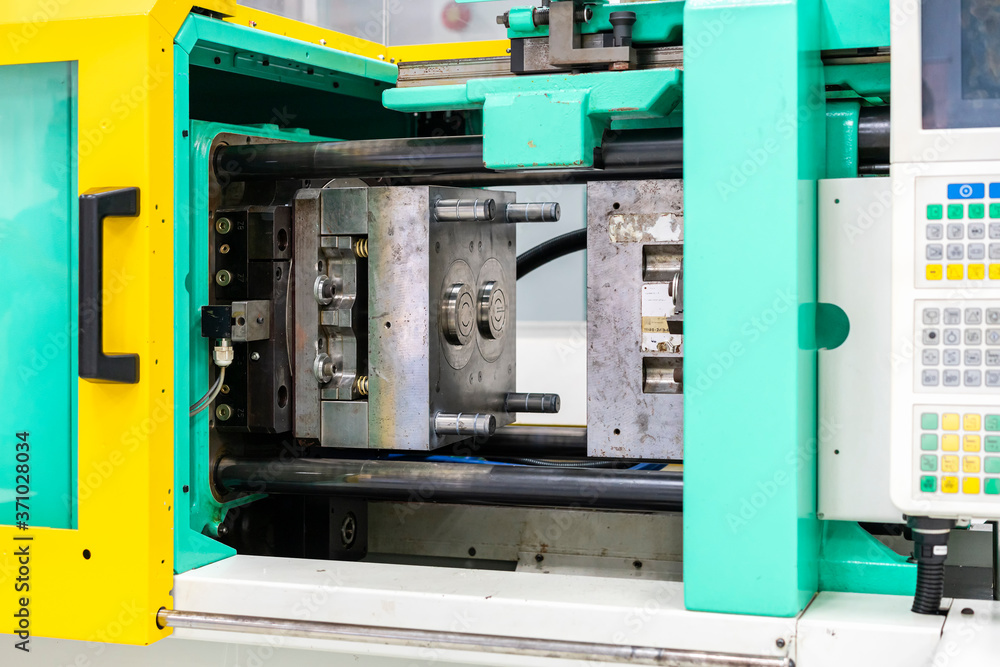 metal mould or plastic injection mold setup on high pressure injection molding machine for mass production or manufacturing in industrial metal mould or plastic injection mold setup on high pressure injection molding machine for mass production or manufacturing in industrial