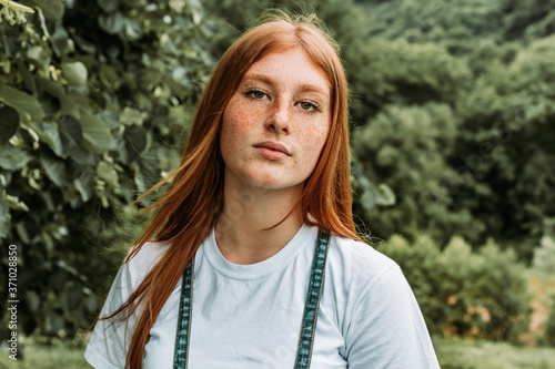 Close-up portrait of young teen freckled ginger girl