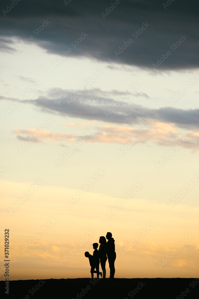 Silhouette of a Family on the beach